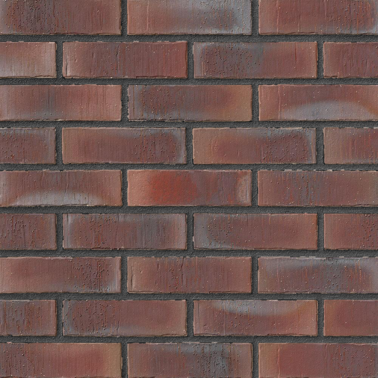 Rote Backsteinmauer mit gleichmäßigen Fugen.