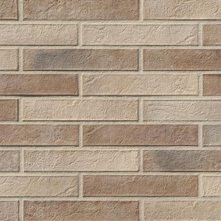 Beigefarbene Ziegelwand mit rechteckigen Steinen.