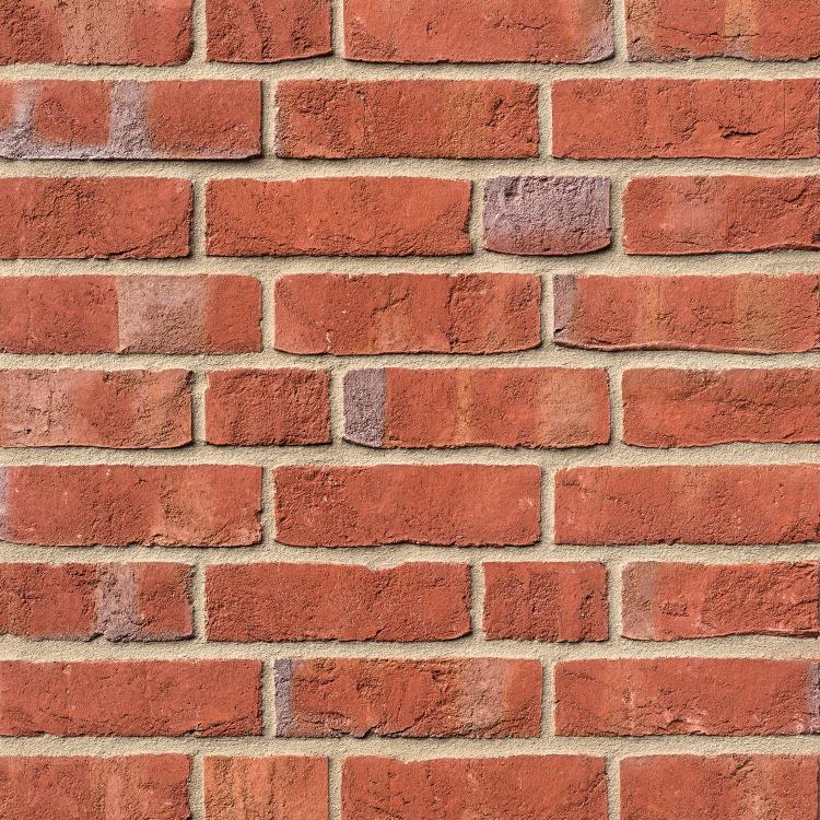 Ziegelwand mit roten DORNUM-Verblendern und grauem Mörtel.