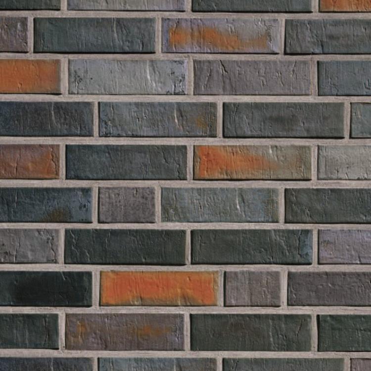 Graue und orangefarbene Backsteinmauer, leicht rustikal.