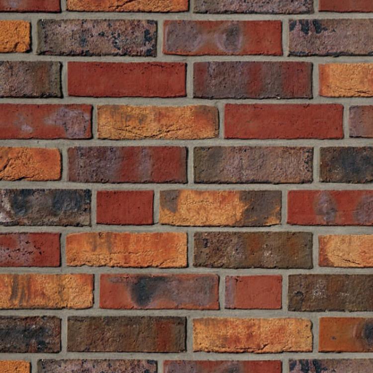 Rote Backsteinmauer mit verschiedenen Farbtönen.